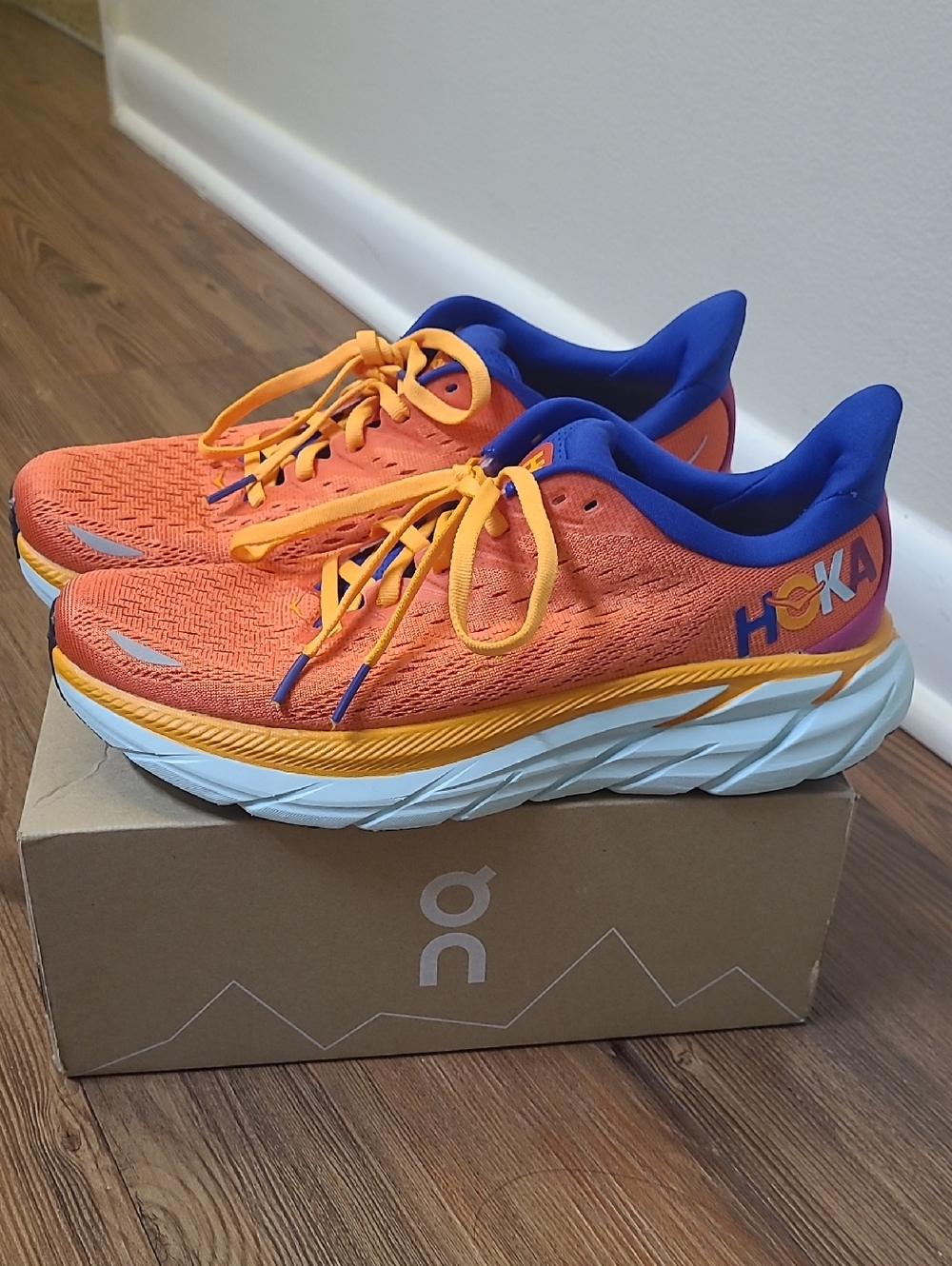 Hoka for women  Orange and Blue Athletic Sneaker used excellent condition. 7D